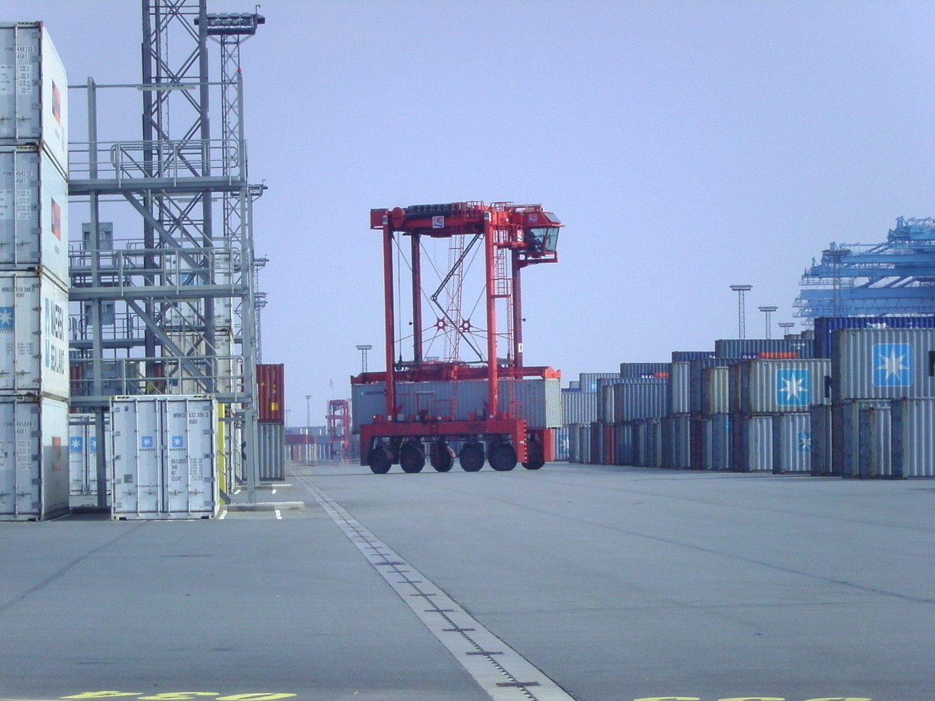 Straddle carrier working a container terminal yard
